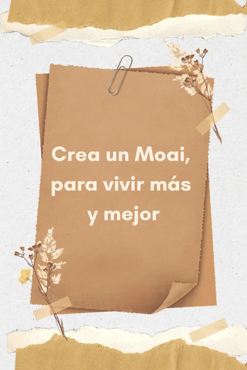 Tarjeta con el texto Crea un moai, para vivir más y mejor sobre papel kraft con flores secas